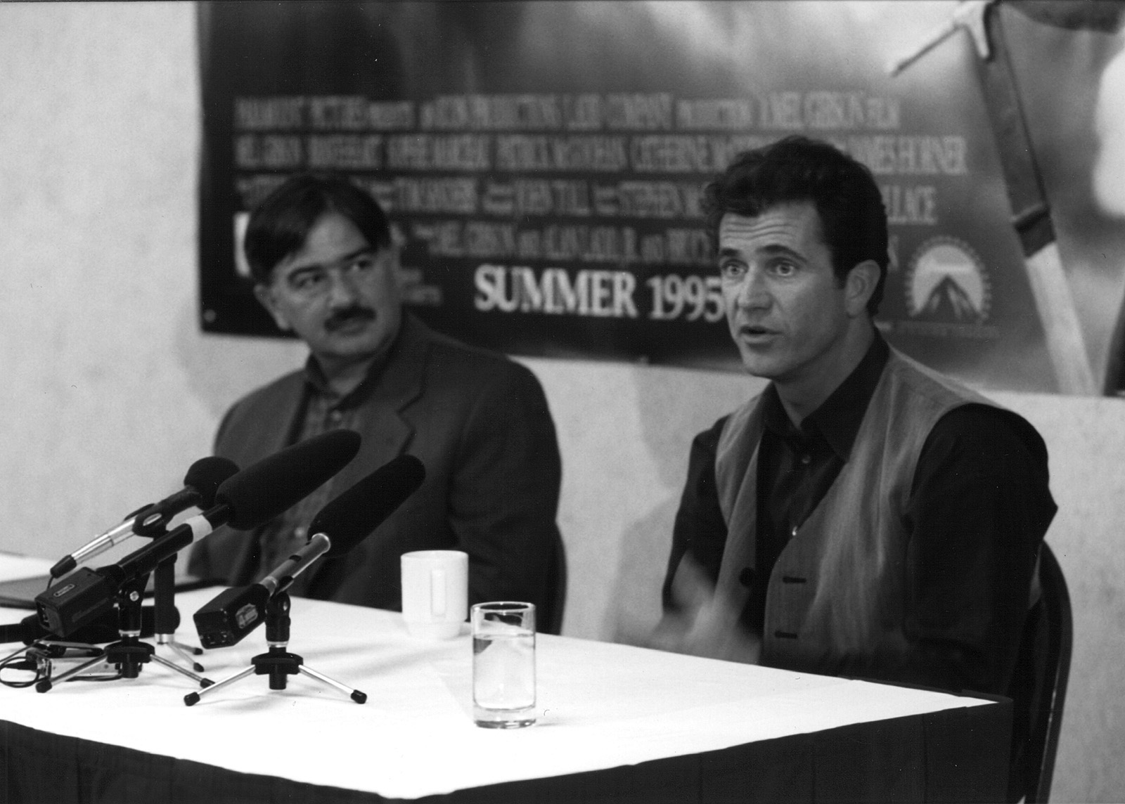 Festival founder, Darryl Macdonald, talks with actor and director, Mel Gibson, at a press conference for the world premiere of his film, Braveheart, which opened the festival and earned him an Academy Award for Best Picture