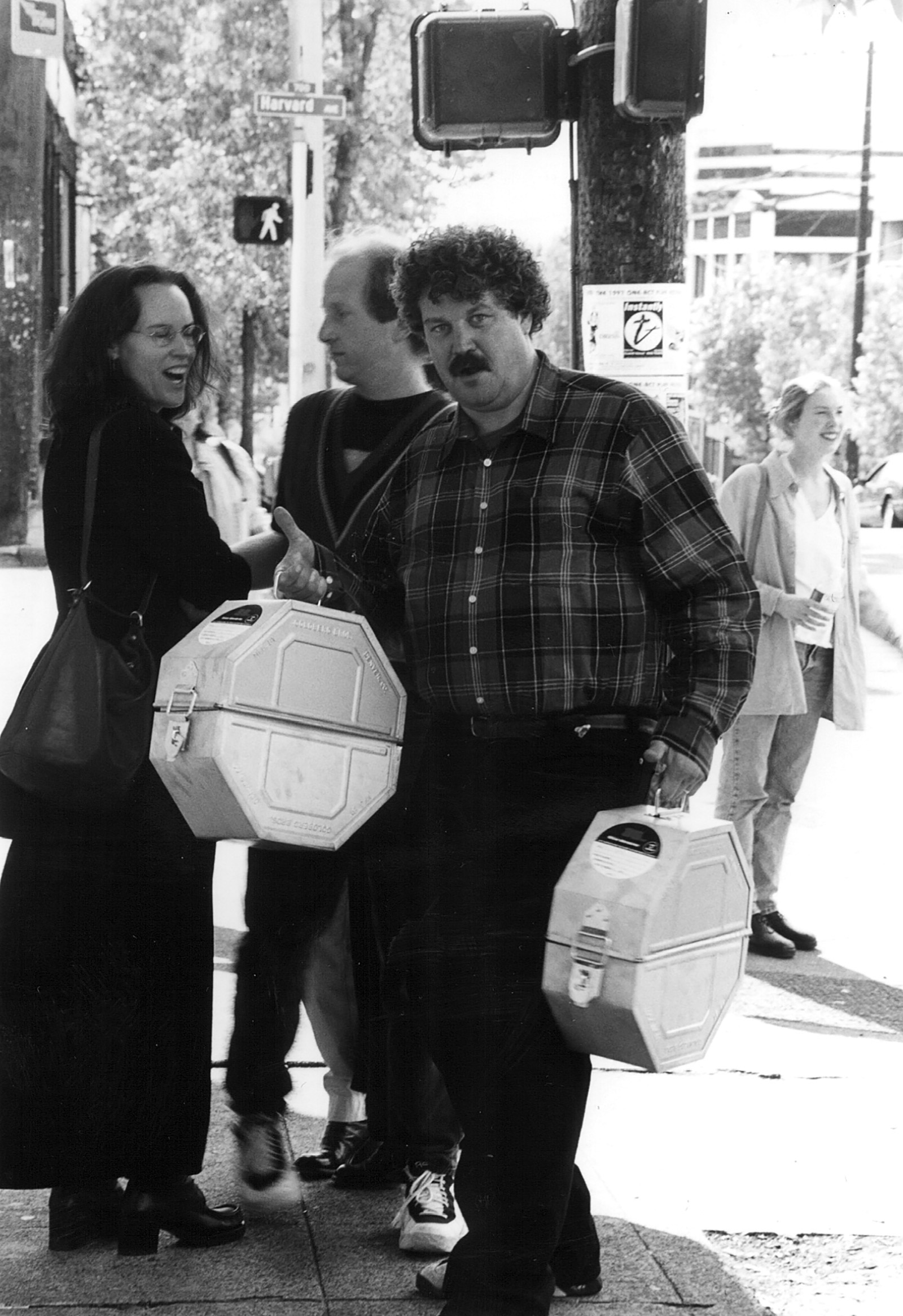 Jeff Dowd, film producer and former SIFF staffer, poses on the streets of Seattle with film cans