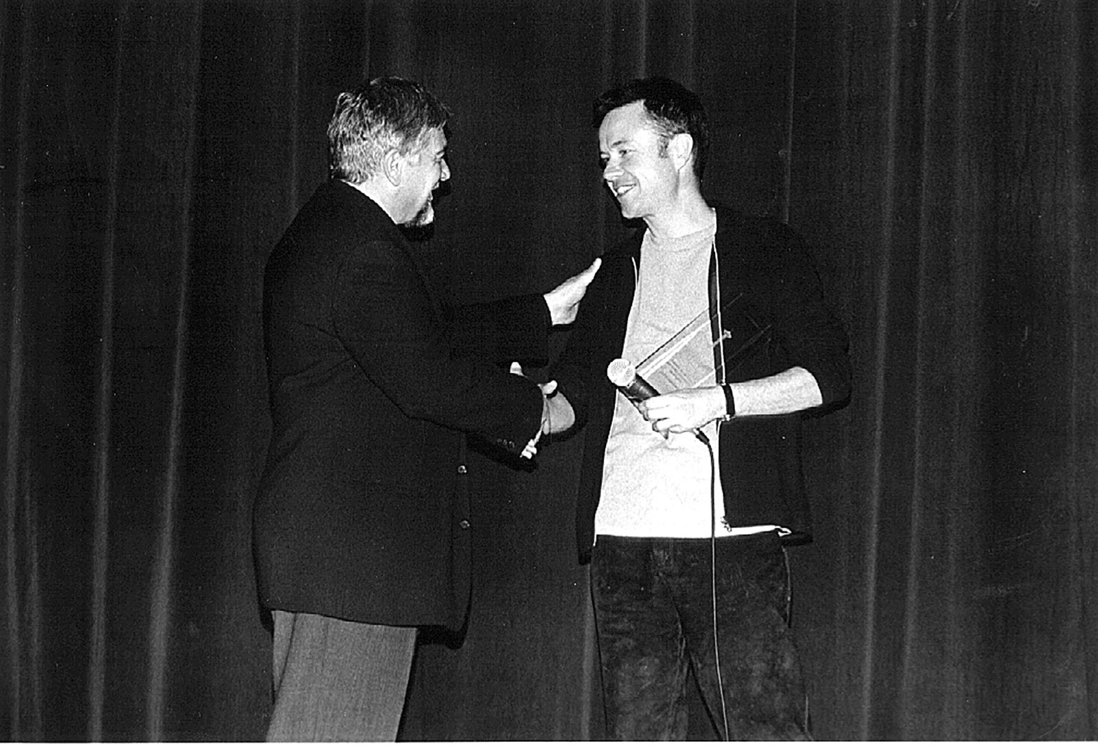 Festival founder, Darryl Macdonald, shakes hands with director, Michael Winterbottom, during the Emerging Masters series