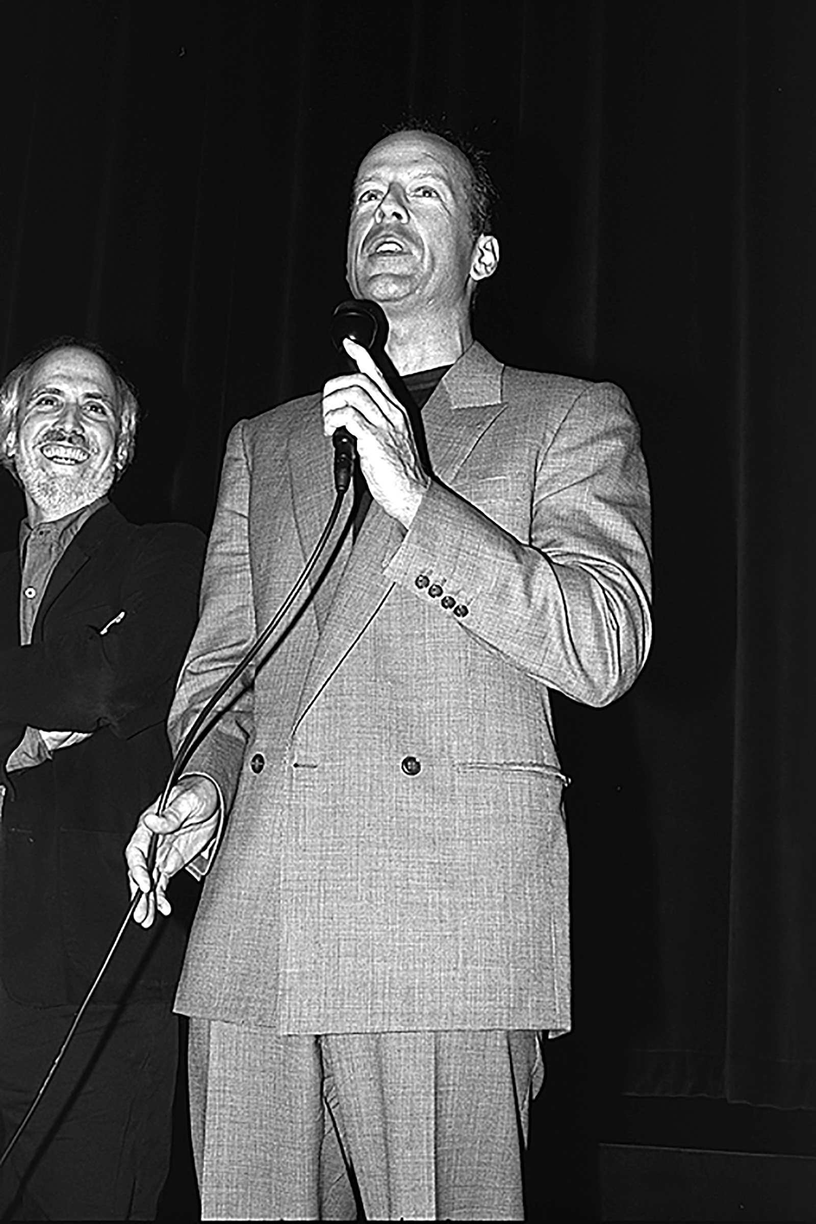 Actor, Bruce Willis, graces the stage, with director, Alan Rudolph, to celebrate their film, Breakfast of Champions