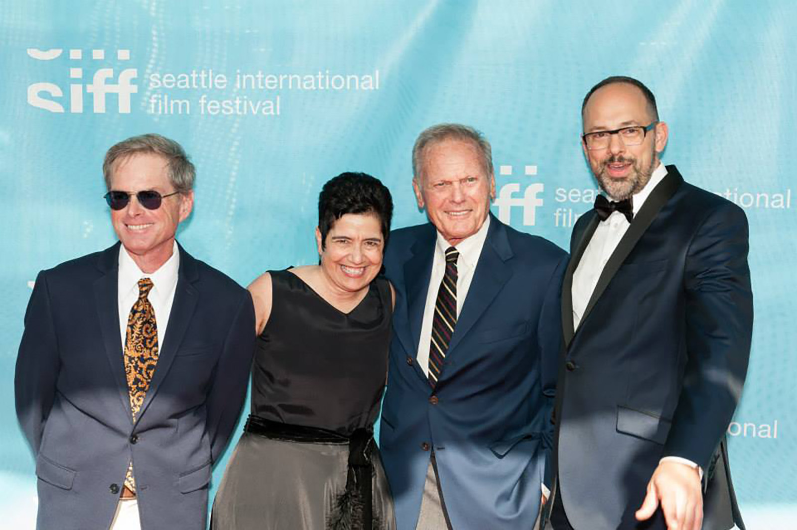 SIFF Managing Director, Mary Bacarella, and Artistic Director, Carl Spence, grace the red carpet on Opening Night with attendees, including photographer, Patrick McMullen
