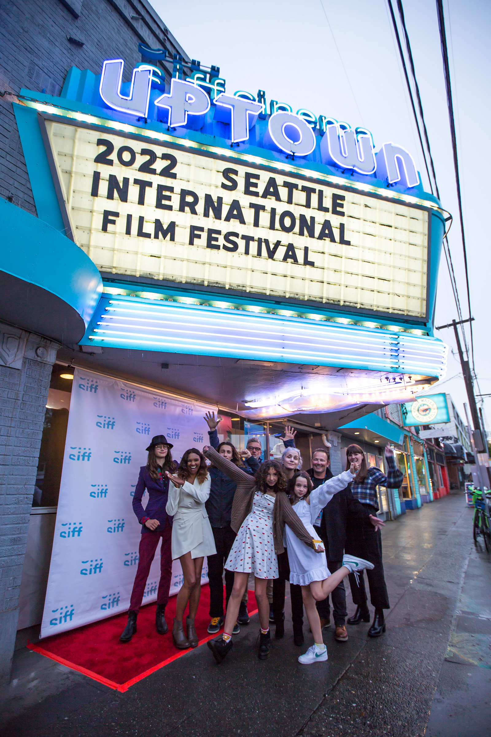 Cast and crew from the film, Are We Lost, celebrate the 48th Seattle International Film Festival under the SIFF Cinema Egyptian marquee